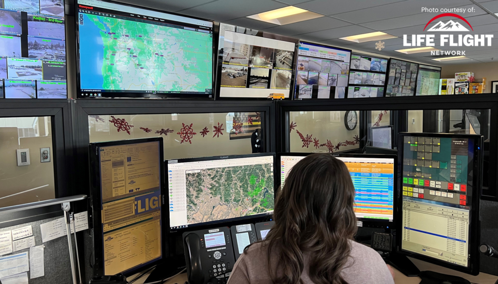 Control room at Life Flight Network featuring multiple monitors displaying real-time data and maps, powered by Bigleaf Networks' reliable connectivity solutions